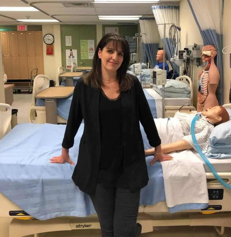 AU Master of Nursing graduate Christine Quesnel, pictured in the nursing lab where she works teaching skills to bachelor of nursing students.