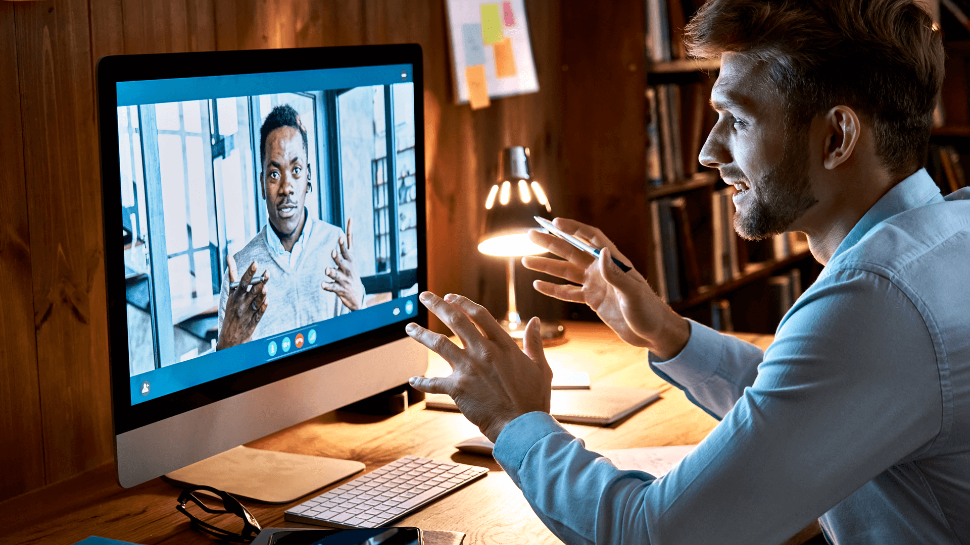 two people talk in a virtual meeting