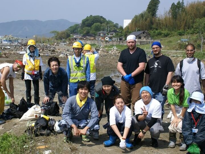 Dr. Henry Tsang pictured with a team of workers on a post-disaster clean-up and reconstruction mission in Japan following a 2011 earthquake and tsunami