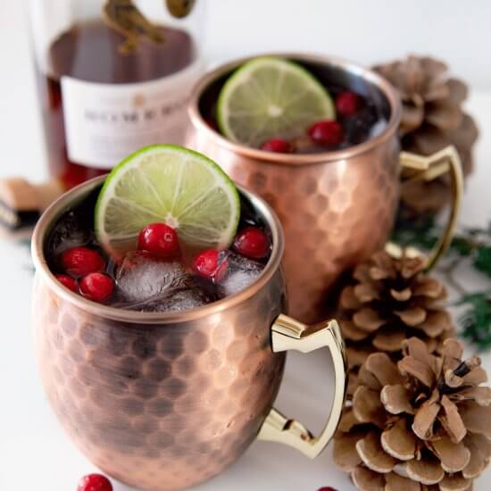 Two mule cups with festive decoration around