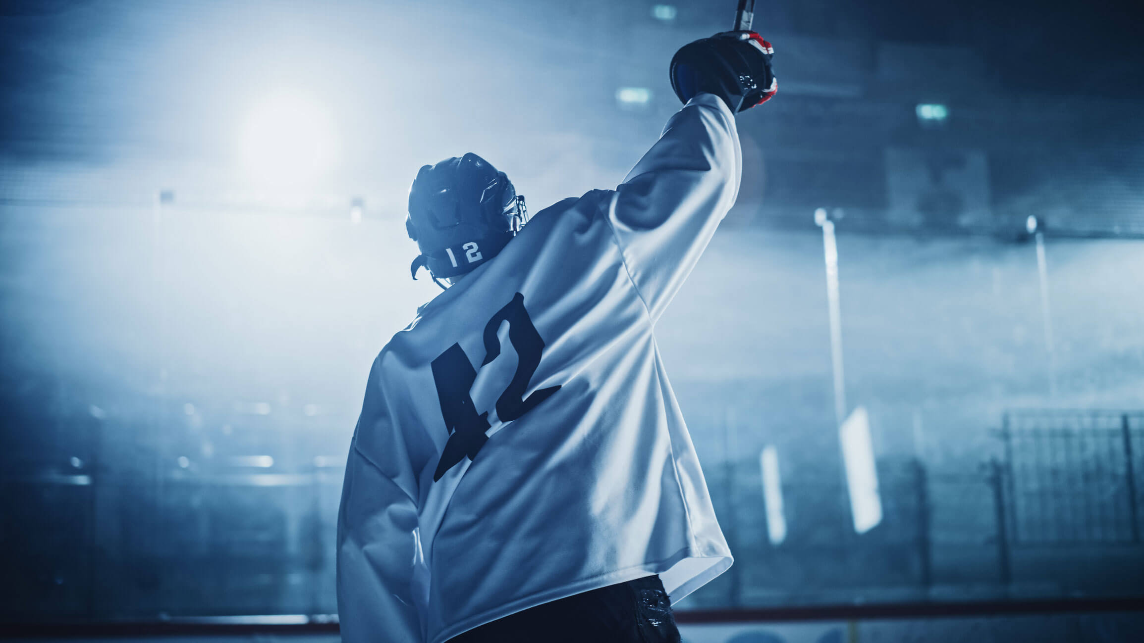 hockey player with raised arm