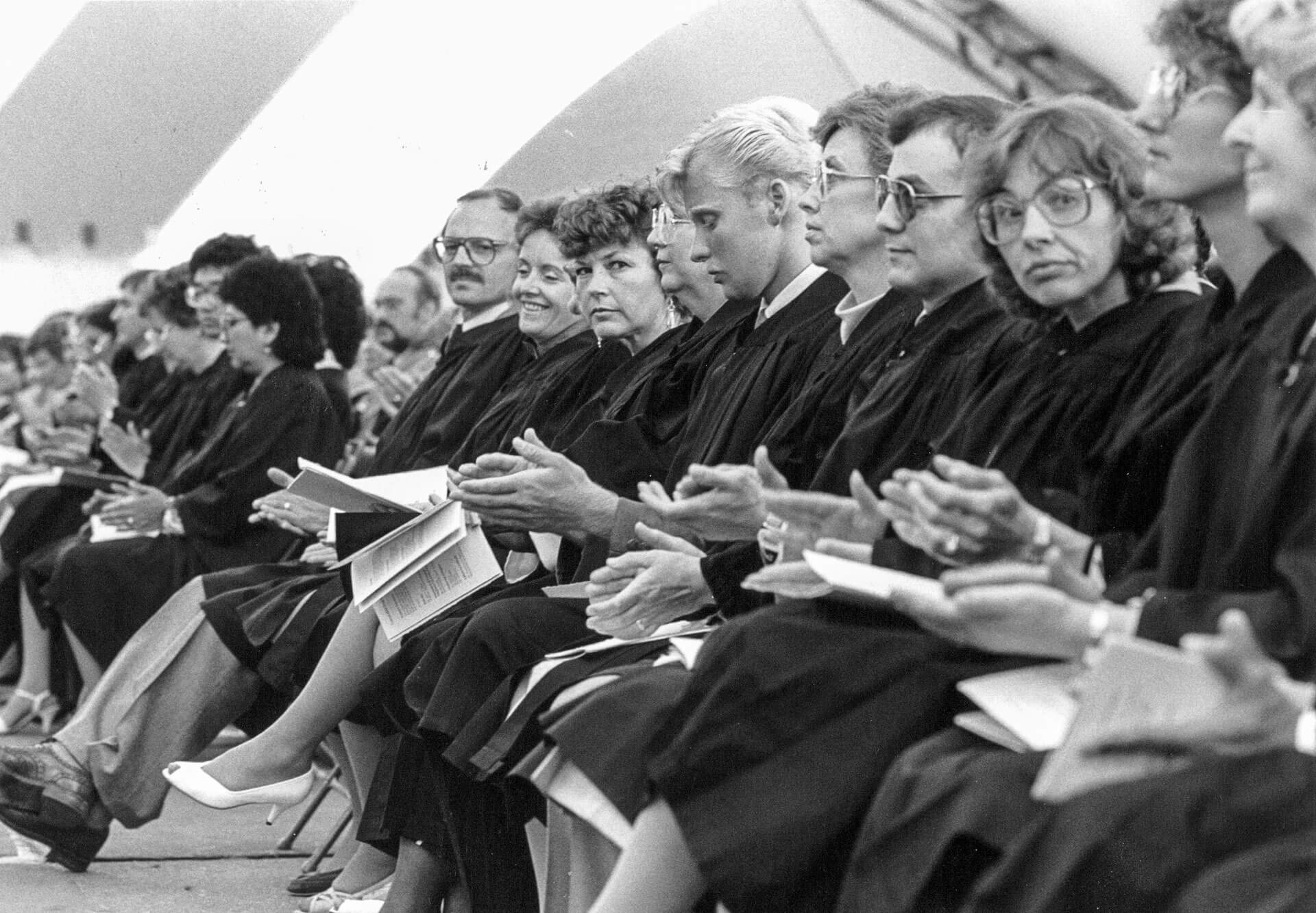 vintage photo of graduates seated in gowns at convocation