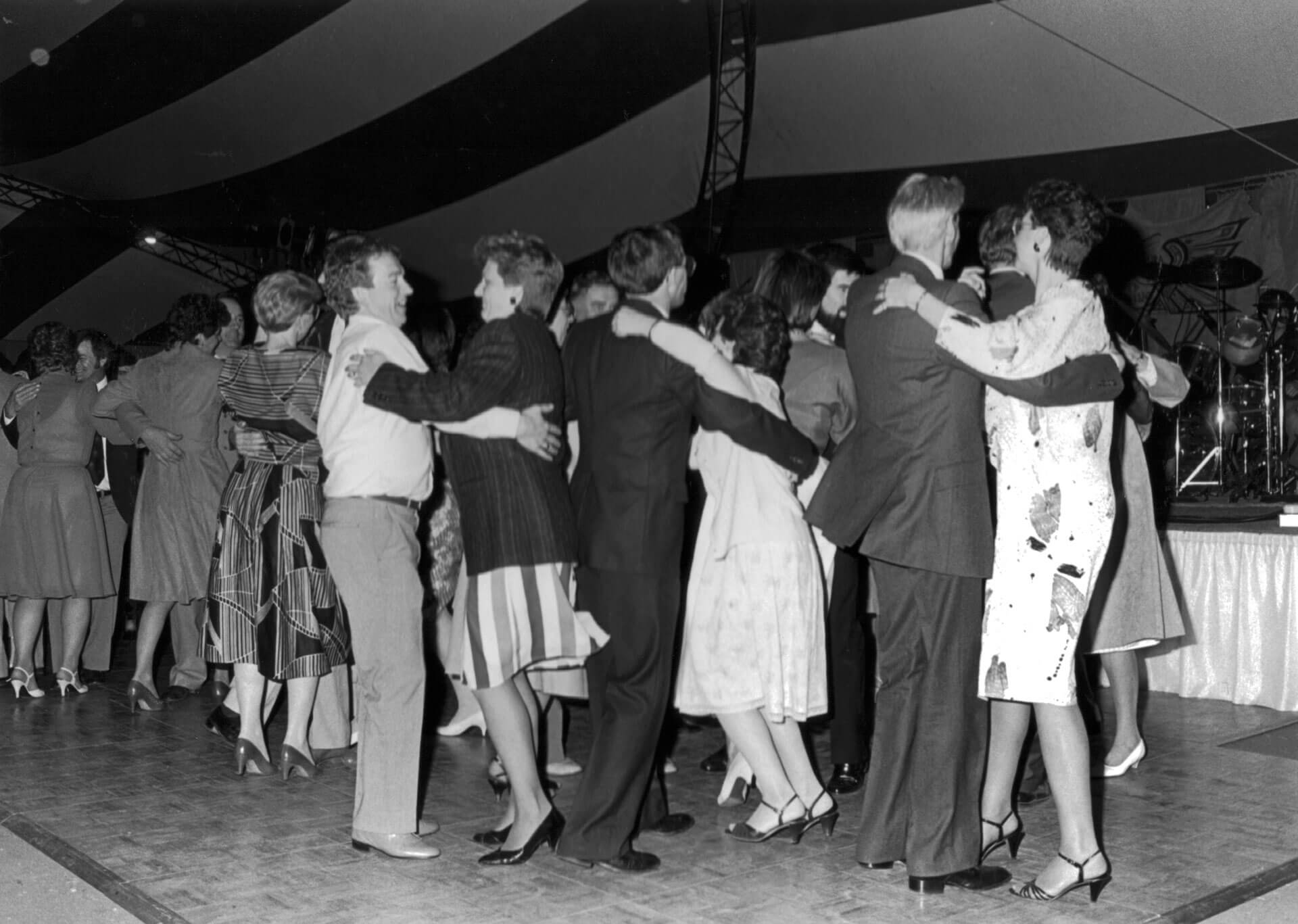 People dancing at a convocation ceremony in the 80s