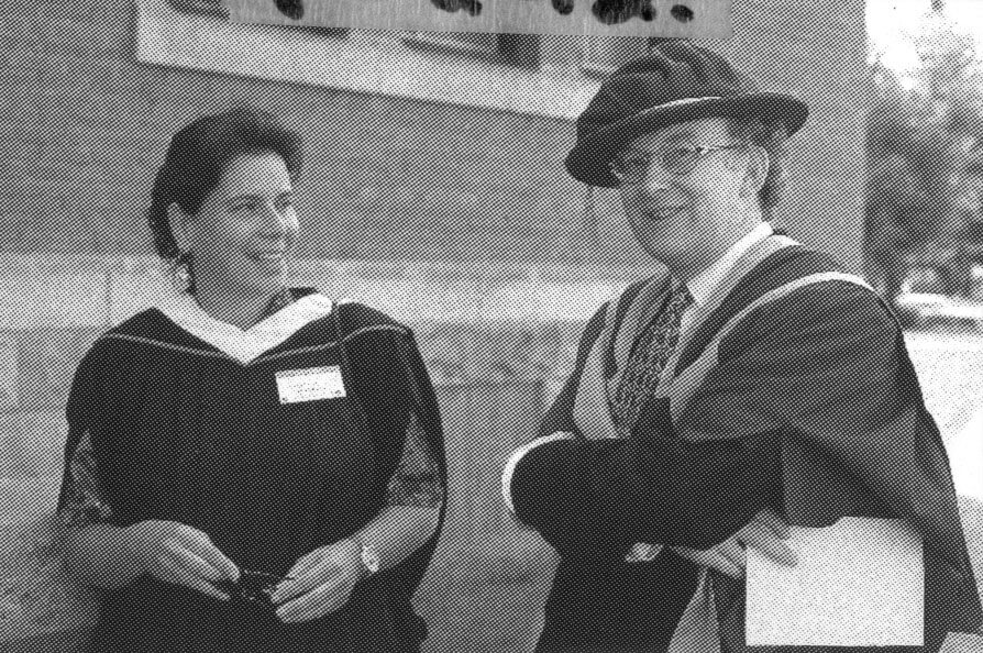 Former AU dean Dr. Stephen Murgatroyd (right) stands with staffer Randi Allan prior to convocation ceremonies circa 1995