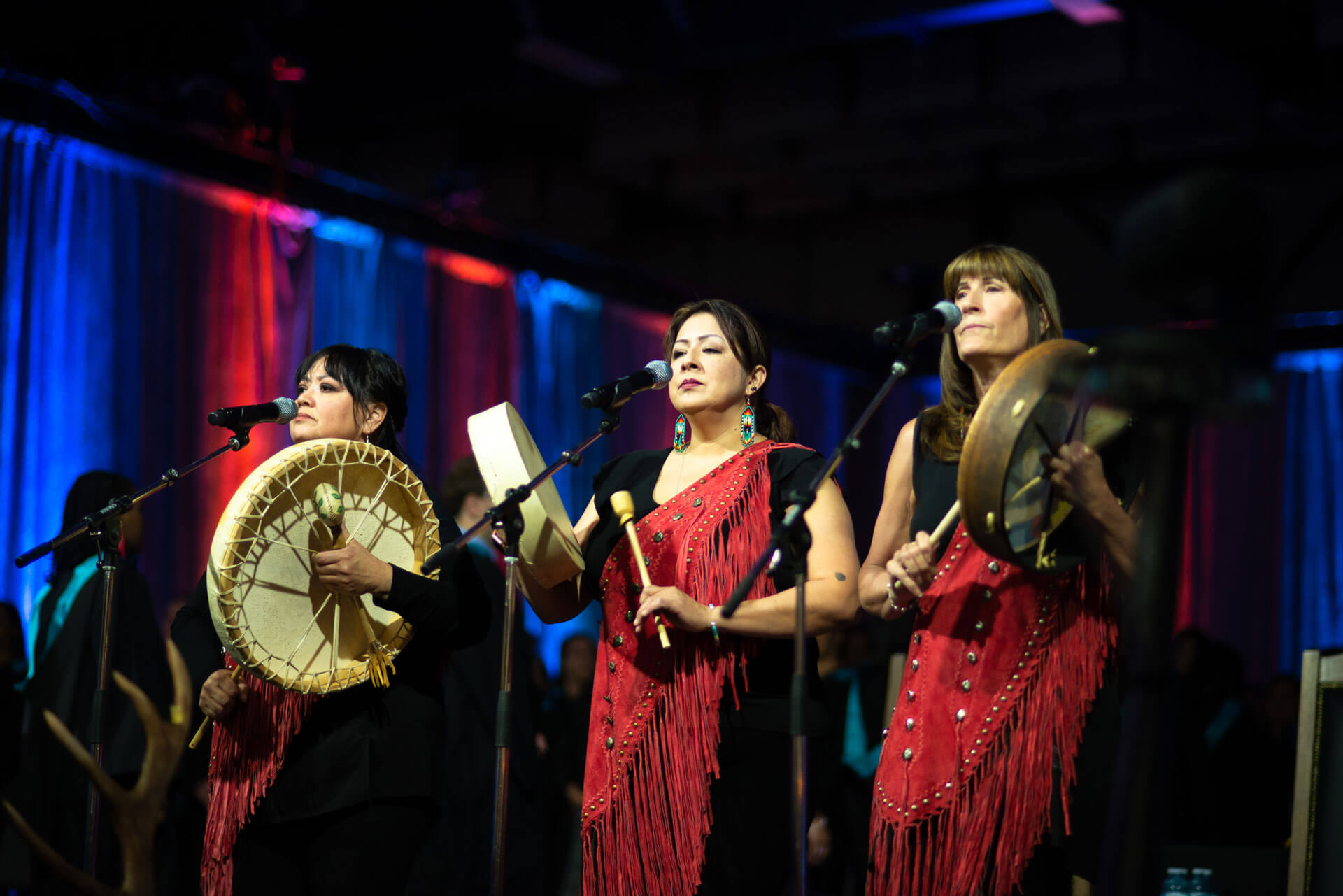 Members of ASANI sing and perform drums during opening ceremonies at convocation in Westerner Park Exhibition Hall in 2019.