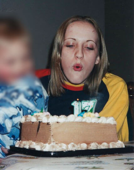 Celia Koehler turns 17 and blows out candles on a cake