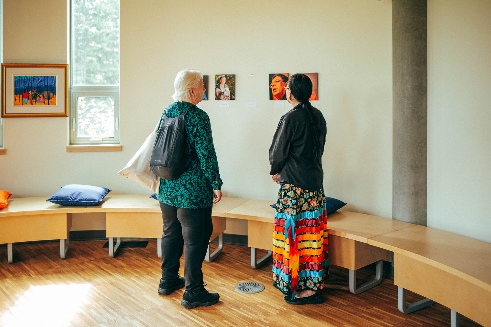 two people view artwork in Bertha Clark-Jones O.C. Art Gallery